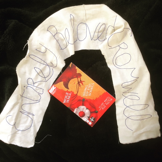 Embroidered fabric reading Entirely Beloved Cromwell, with a copy of the play script