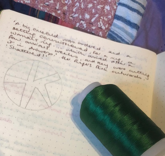 Green thread, a notebook, containing a sketch for a quilting design